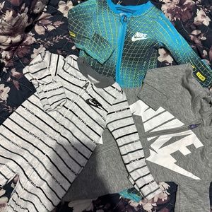 3 Nike onesies